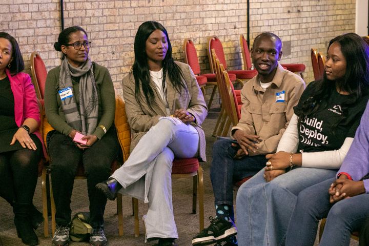 A small circle of attendees in conversation