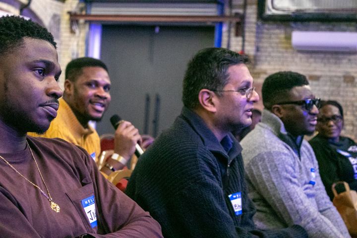An attendee asking a question into a microphone