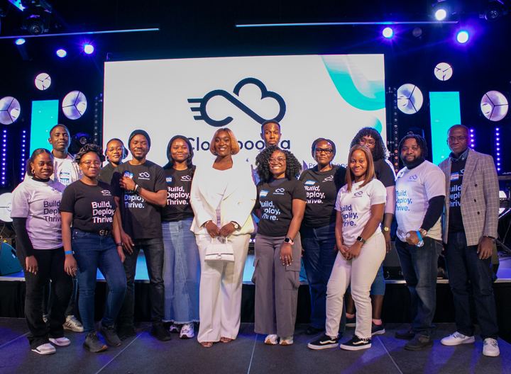 The Cloudboosta team on stage under the Cloudboosta logo